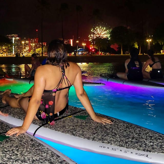 Honolulu: Fireworks Glow and Flow Yoga Class - Floating yoga with a front-row view of Honolulu