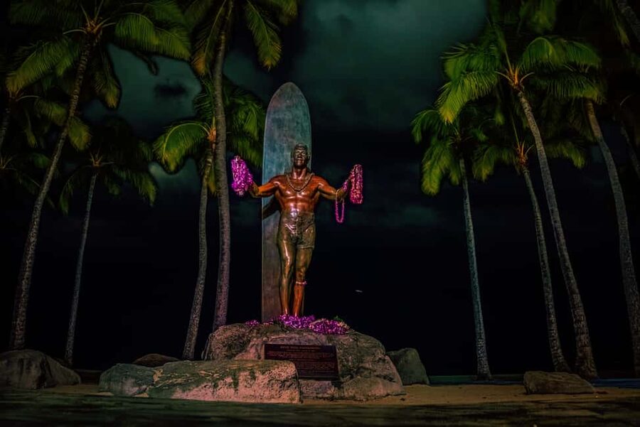 Waikiki Ghosts Boos and Booze Haunted Pub Crawl - Walking past the Duke Kahanamoku Statue